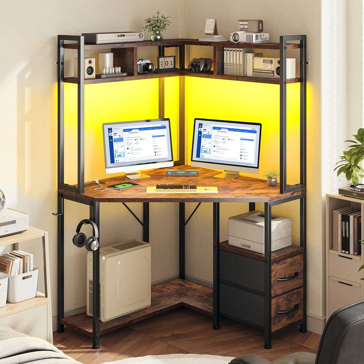 Corner gaming desk includes outlets, LED lights, drawers, shelves, hooks.