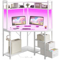 Corner gaming desk includes outlets, LED lights, drawers, shelves, hooks.