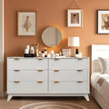 Modern fluted dresser offers six drawers, faux marble top, and versatile storage
