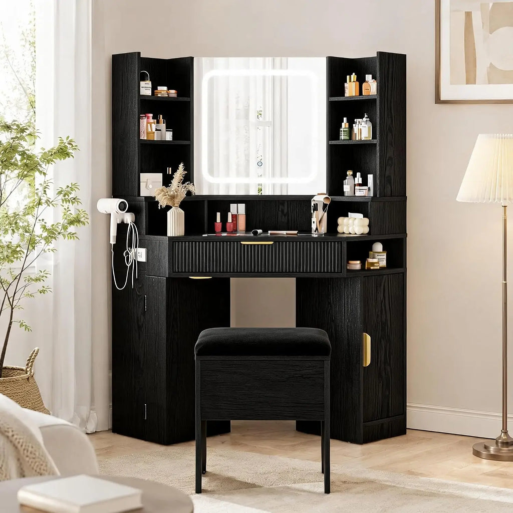 Corner vanity features a lighted mirror, glass top, charging station, and drawers.